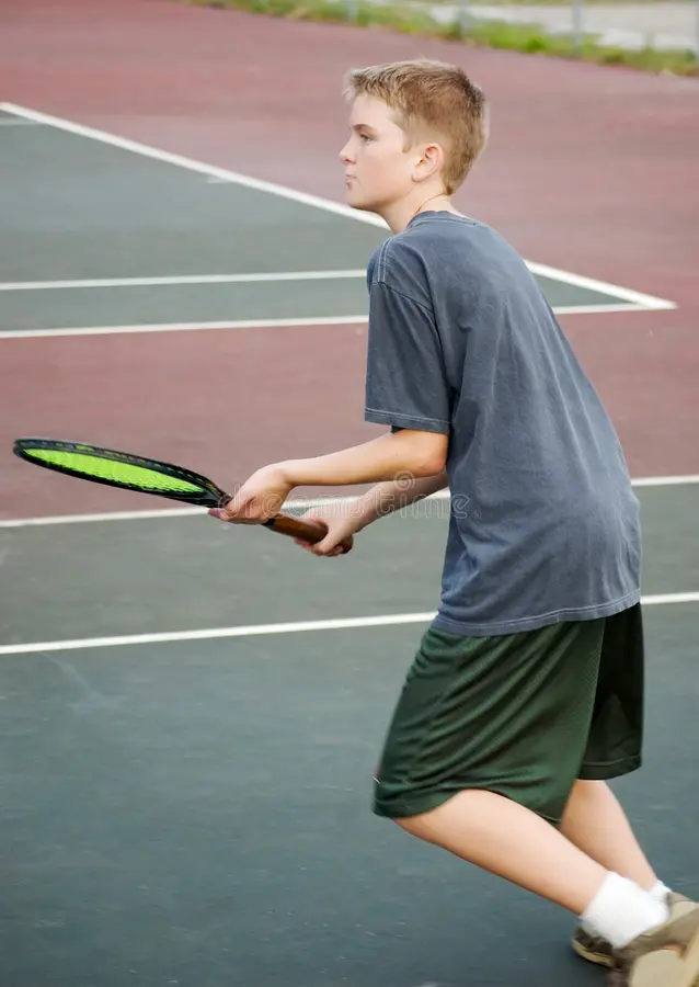 Andrew on a tennis court
