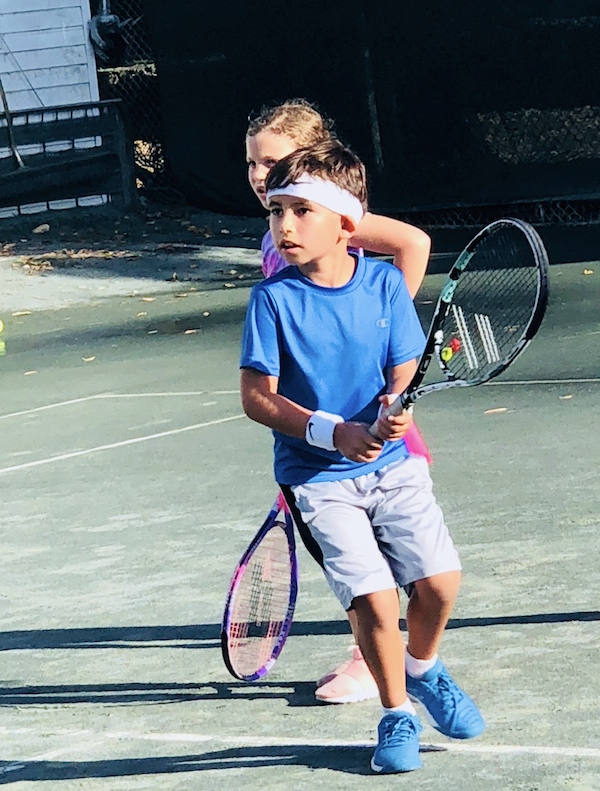 Christian on a tennis court