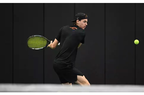 Tennis player preparing to return a shot
